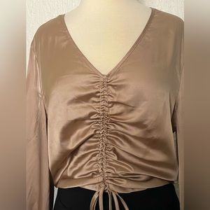 Silky soft long sleeved blouse with ruched tie front